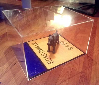 Monopoly game piece Scotty the dog with Boardwalk